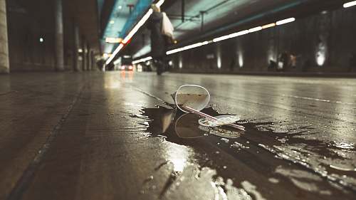 the hague white paper cup spilled on road urban